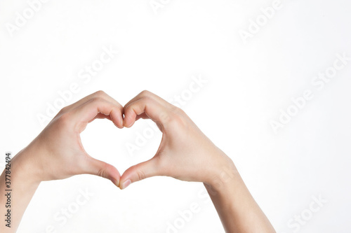 man s hands in heart shape on white background