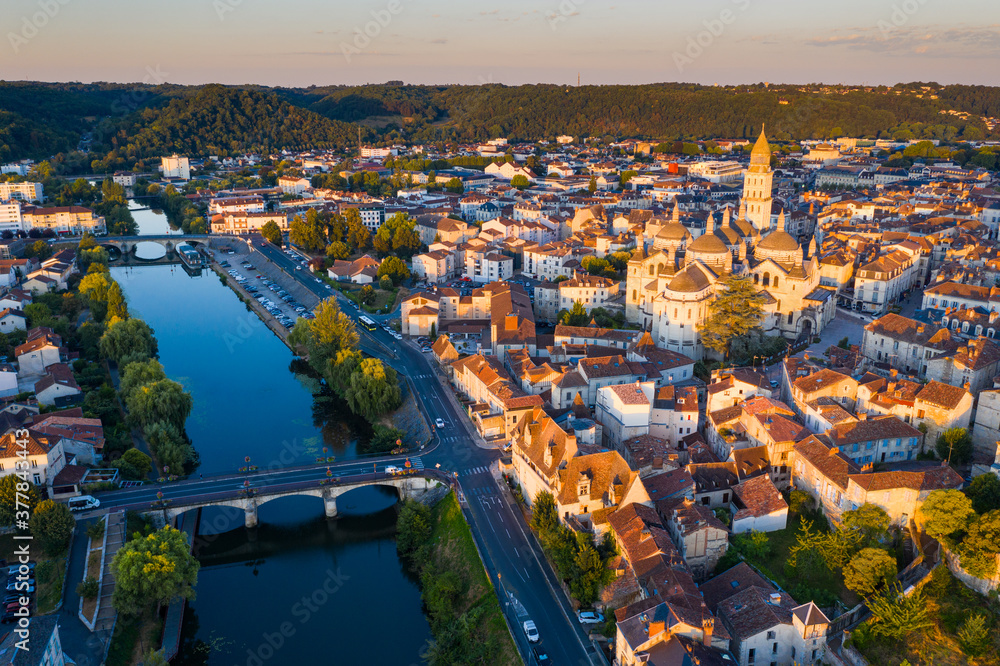 Picturesque aerial view of summer cityscape of Perigueux overlooking medieval Cathedral of Saint Front in first rays of morning sun, France..