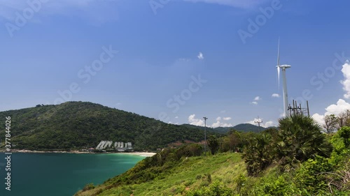 beautiful landscape with the ocean and wind turbine pole