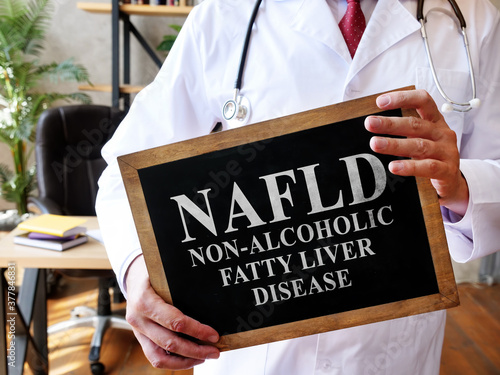 Non-alcoholic fatty liver disease NAFLD the doctor is holding a sign. photo
