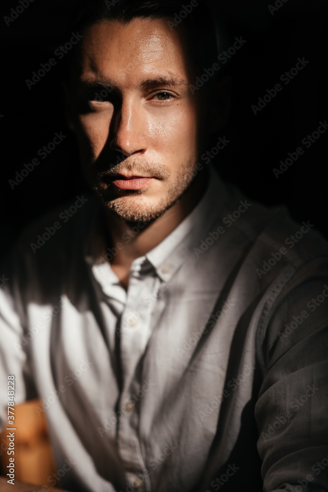 young attractive man looking and thinking. portrait of handsome man sitting in cafe young attractive man looking and thinking. portrait of handsome man sitting in cafe