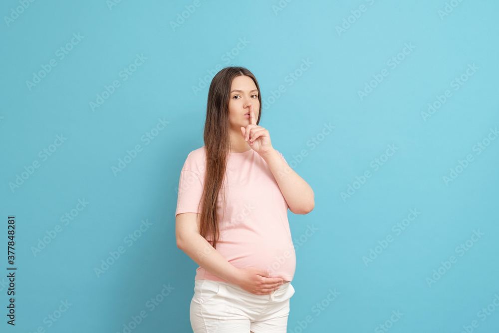 beautiful young pregnant woman asks not to make noise beautiful young pregnant woman asks not to make noise