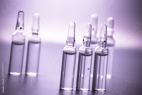 glass medicine ampoules on a white background close up