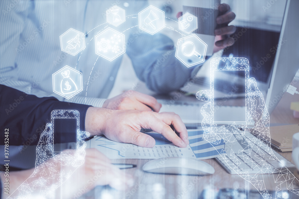 Technology theme hologram with man working on computer on background. High tech concept. Multi exposure. Technology theme hologram with man working on computer on background. High tech concept. Multi exposure.