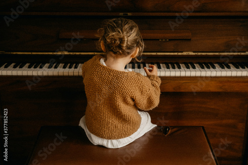 Young child playing piano