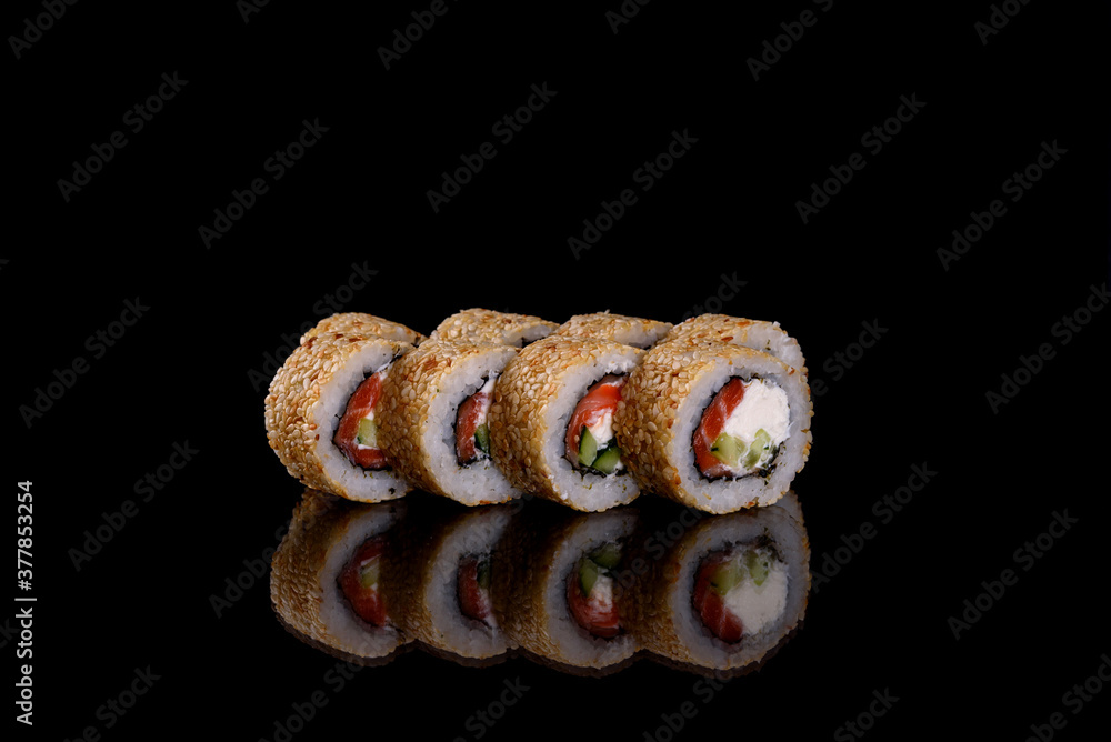 Fresh delicious beautiful sushi rolls on a dark background Fresh delicious beautiful sushi rolls on a dark background