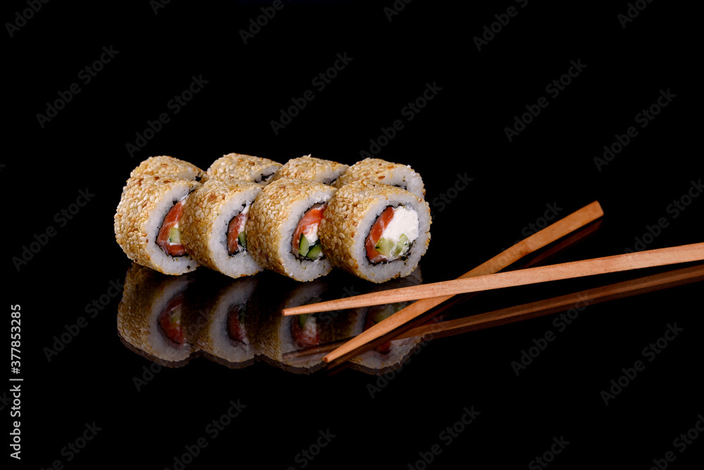 Fresh delicious beautiful sushi rolls on a dark background Fresh delicious beautiful sushi rolls on a dark background