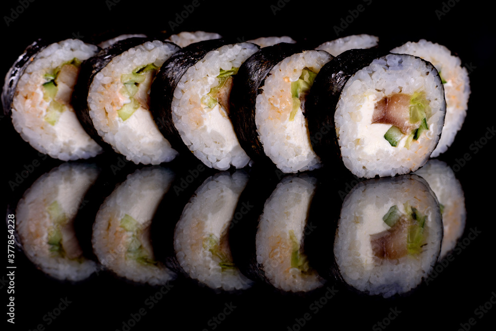 Fresh delicious beautiful sushi rolls on a dark background Fresh delicious beautiful sushi rolls on a dark background