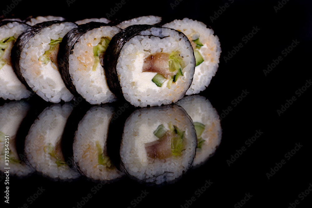 Fresh delicious beautiful sushi rolls on a dark background Fresh delicious beautiful sushi rolls on a dark background