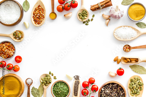 Herbs spices and flavoring on kithen desk, top view