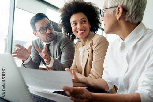 Collaboration and analysis by business people working in office