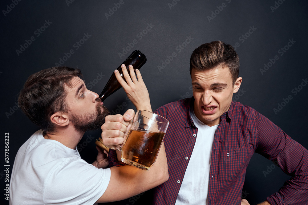 Two drunk friends drinking beer rest fun dark background Two drunk friends drinking beer rest fun dark background