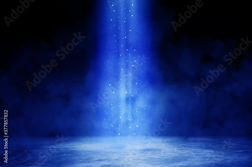 Empty space of Studio dark room with blue lighting effect and fog or mist on concrete floor in black background. 