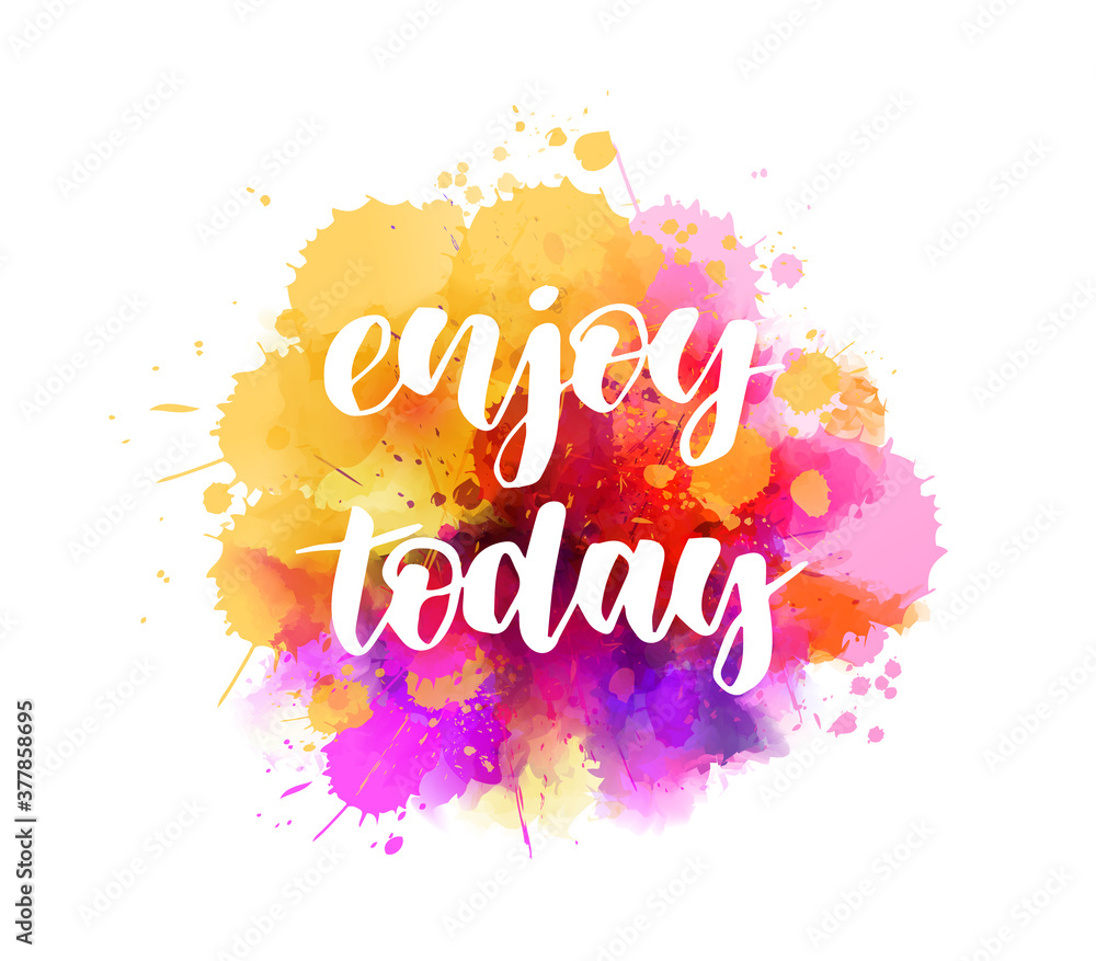 Fototapeta premium Enjoy today - handwritten modern calligraphy lettering on multicolored watercolor splash background. Inspirational handlettering.