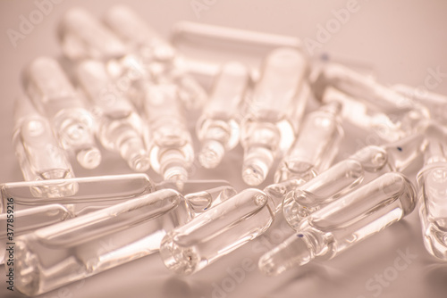 many medical ampoules on a white background. Close-up