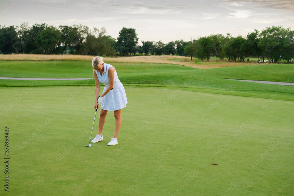 Sportsman Woman Tries Put Ball Into Golf Hole . Sportsman Woman Tries Put Ball Into Golf Hole .