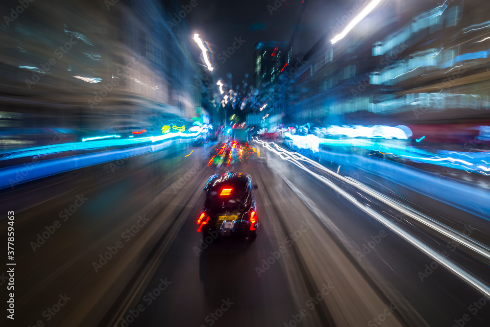 Abstract of light trails from traffic and buildings in the city of London