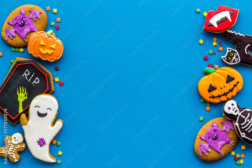 Fototapeta premium Flat lay of homemade Halloween cookies. Top view, copy space