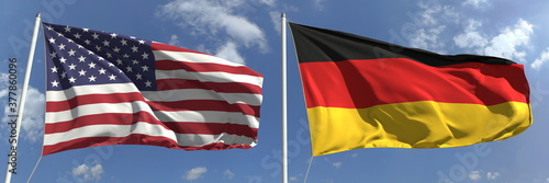 Flags of the USA and Germany on flagpoles. 3d rendering