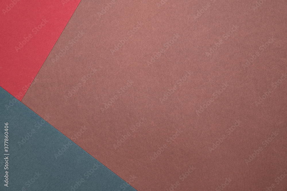 Three sheets of colored paper on a brown background. Green, red. Minimalistic composition. Background for text or design. Empty right side. Top view Three sheets of colored paper on a brown background. Green, red. Minimalistic composition. Background for text or design. Empty right side. Top view