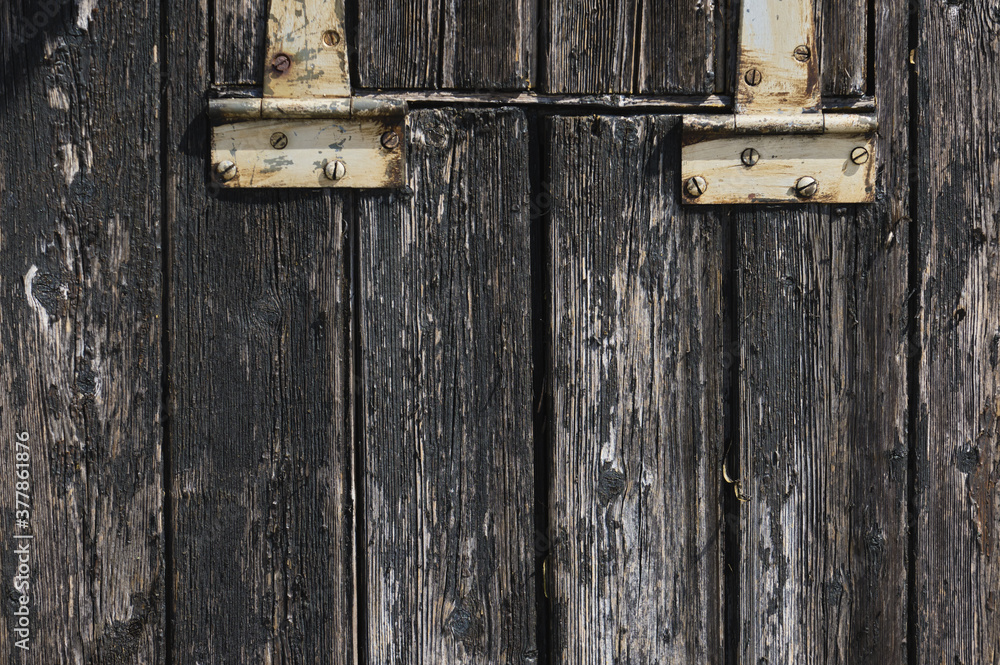 Old hinges and grunge dark textured wooden background Old hinges and grunge dark textured wooden background