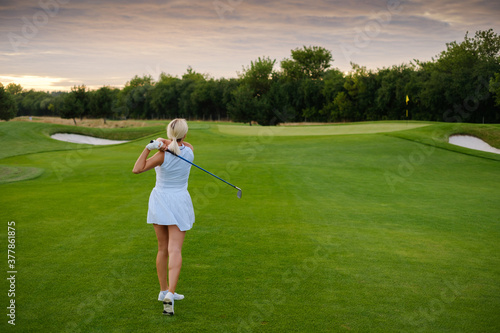 Woman Play Game at Beautiful Big Golf Course .