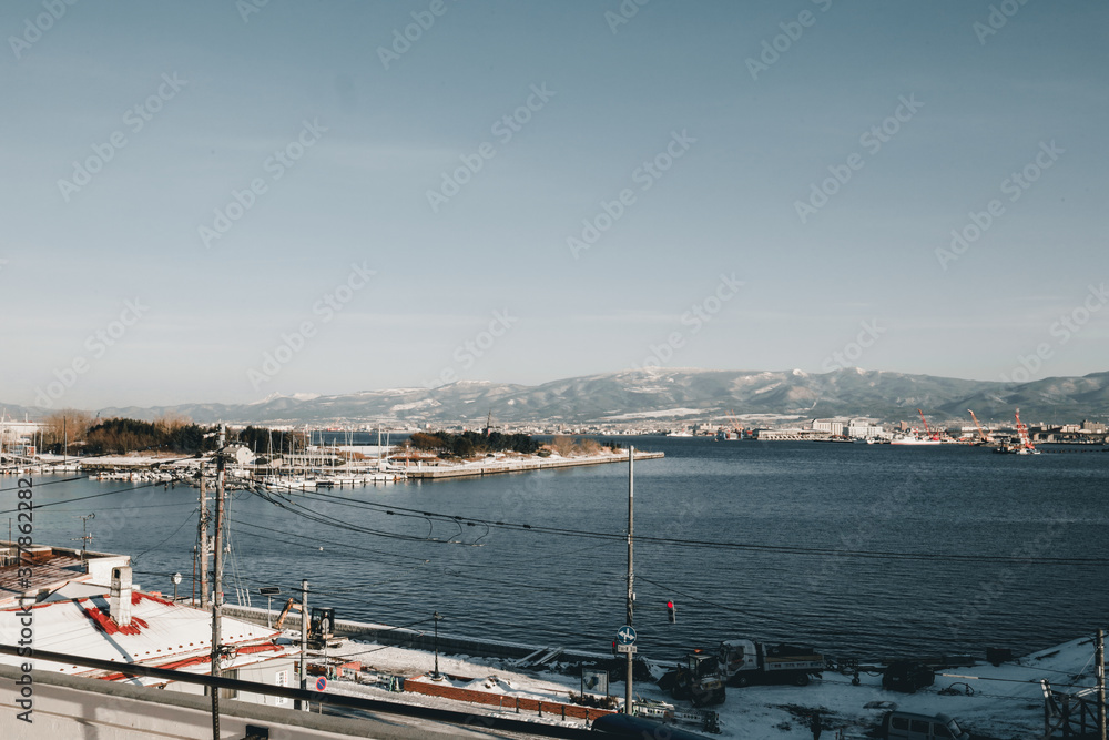 Landmark of Hakodate, Japan cityscape at the historic Red Brick Warehouses. During Winter in the morning with snow on ground Landmark of Hakodate, Japan cityscape at the historic Red Brick Warehouses. During Winter in the morning with snow on ground