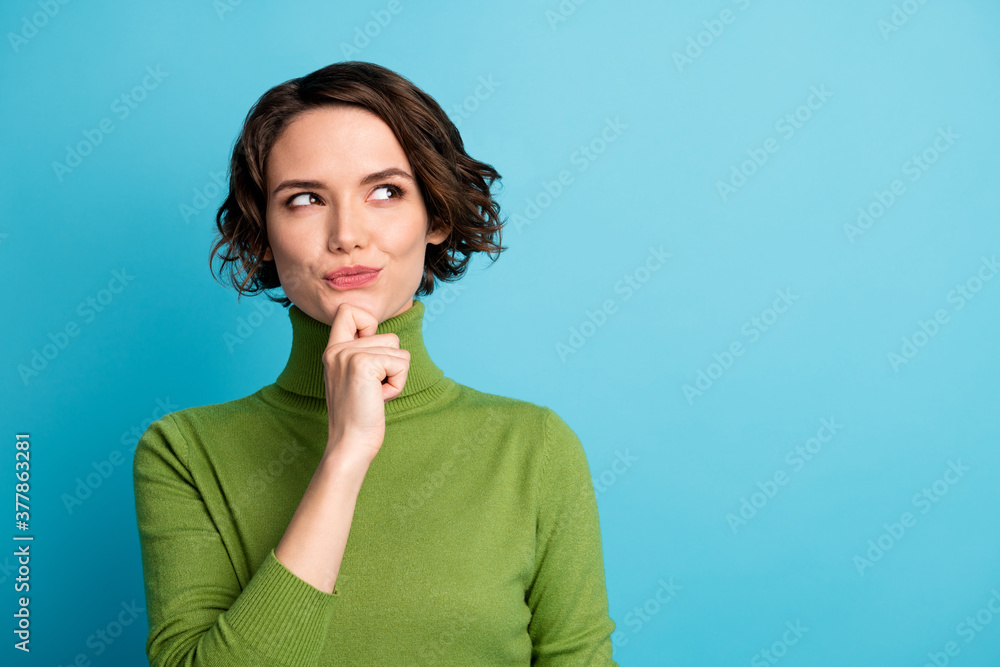 Portrait of minded interested girl touch hand chin look copyspace think thoughts ask question answer wear pullover isolated over blue color background Portrait of minded interested girl touch hand chin look copyspace think thoughts ask question answer wear pullover isolated over blue color background