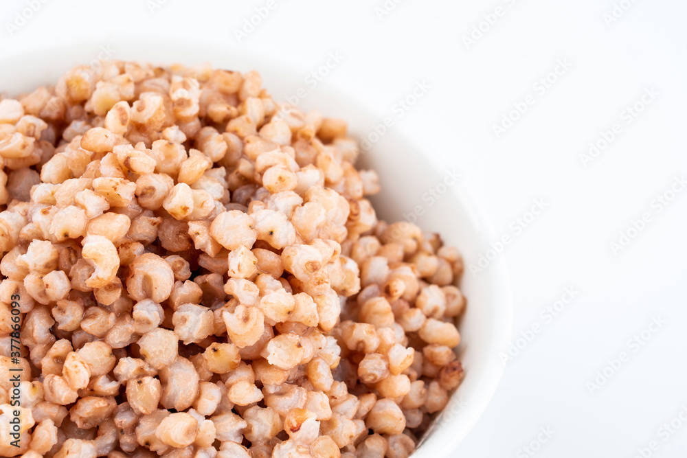 Sorghum rice in a bowl on white background Sorghum rice in a bowl on white background