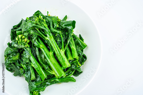 Fried kale cabbage heart in a dish on white background