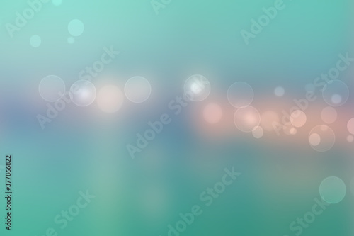 Abstract gradient pink light turquoise blue shiny blurred background texture with circular bokeh lights. Beautiful backdrop. Space for design.