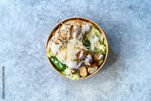 Take Away Healthy Organic Ceaser Salad with Chicken, Parmesan Cheese, Crouton Bread and Yogurt Mayonnaise Sauce.