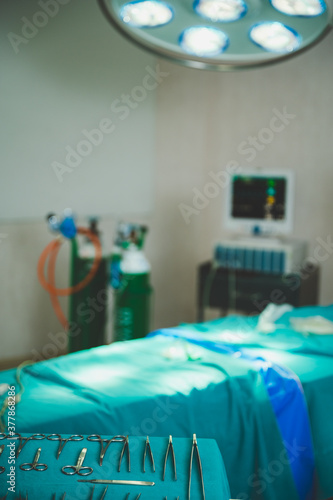 Close-up of operating room with the lamp and oxygen satuation monitor photo