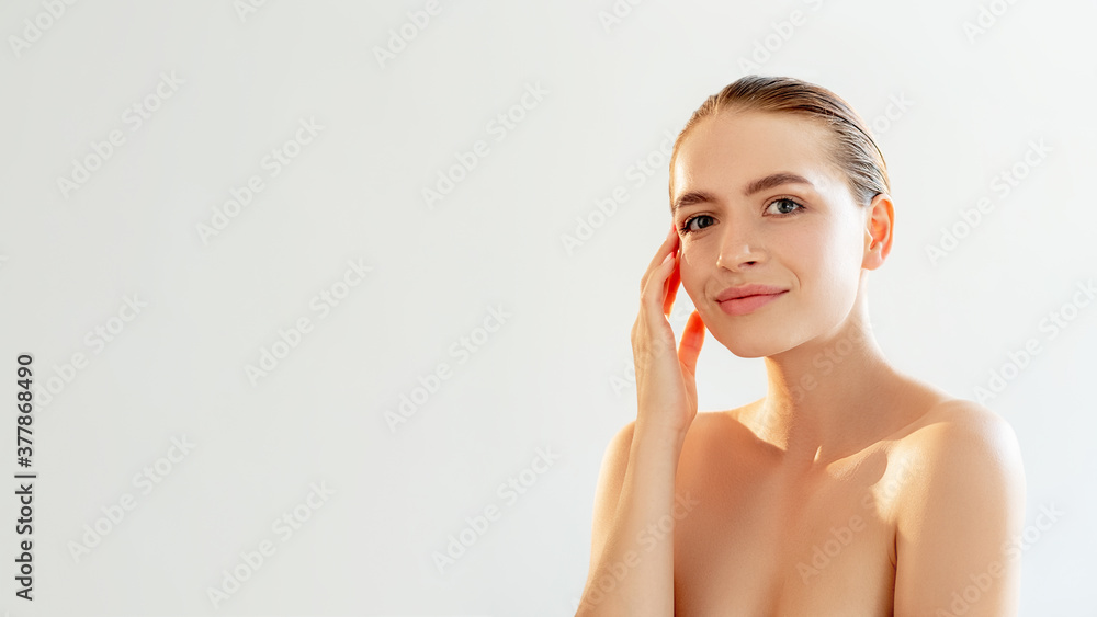 Skincare cosmetology. Face treatment. Portrait of pretty woman with nude makeup bare shoulders smiling isolated on light white copy space background. Beauty procedure. Detox therapy. Skincare cosmetology. Face treatment. Portrait of pretty woman with nude makeup bare shoulders smiling isolated on light white copy space background. Beauty procedure. Detox therapy.