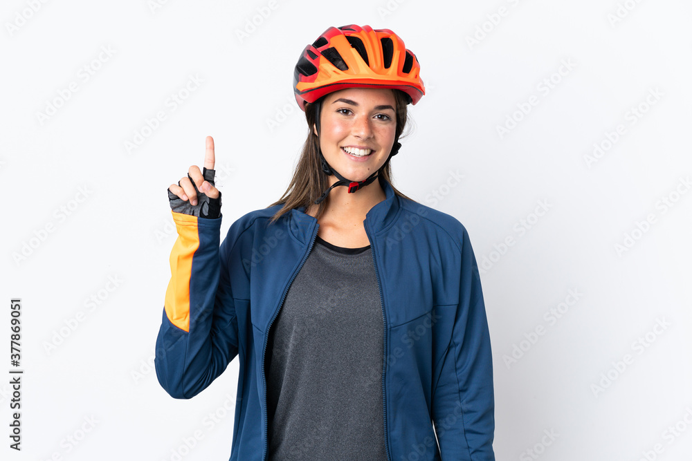 Young cyclist brazilian girl isolated on white  background pointing up a great idea - obrazy, fototapety, plakaty 
