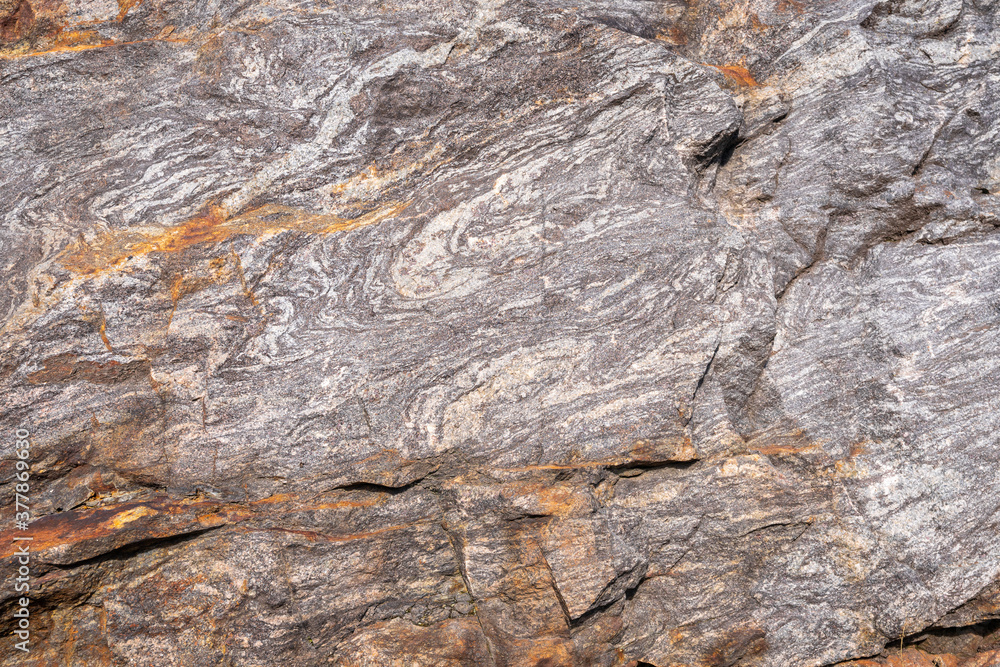 Rusted granite texture. Rusted stone background. Granite rocks. Colorful Rock background. Old Cracked Rusty Rough texture. Grunge Abstract Stone Surface. Rusted granite texture. Rusted stone background. Granite rocks. Colorful Rock background. Old Cracked Rusty Rough texture. Grunge Abstract Stone Surface.