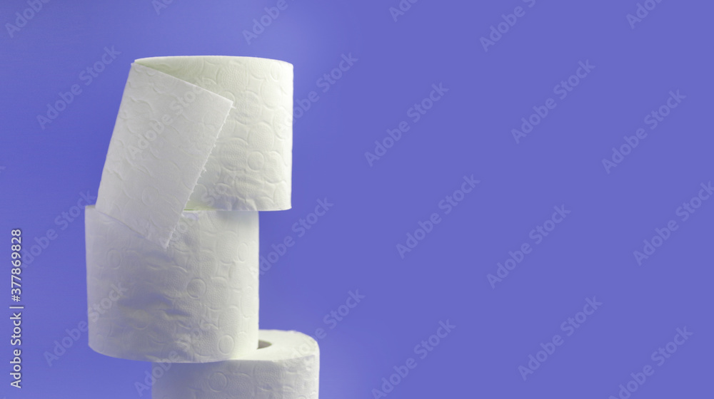 Obraz premium White toilet paper rolls on the gray background. Hygiene concept.
