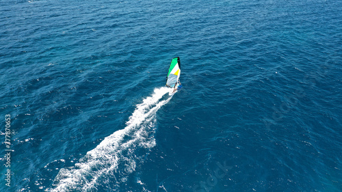 Aerial drone photo of wind surfer in open ocean deep blue sea on a windy morning © aerial-drone