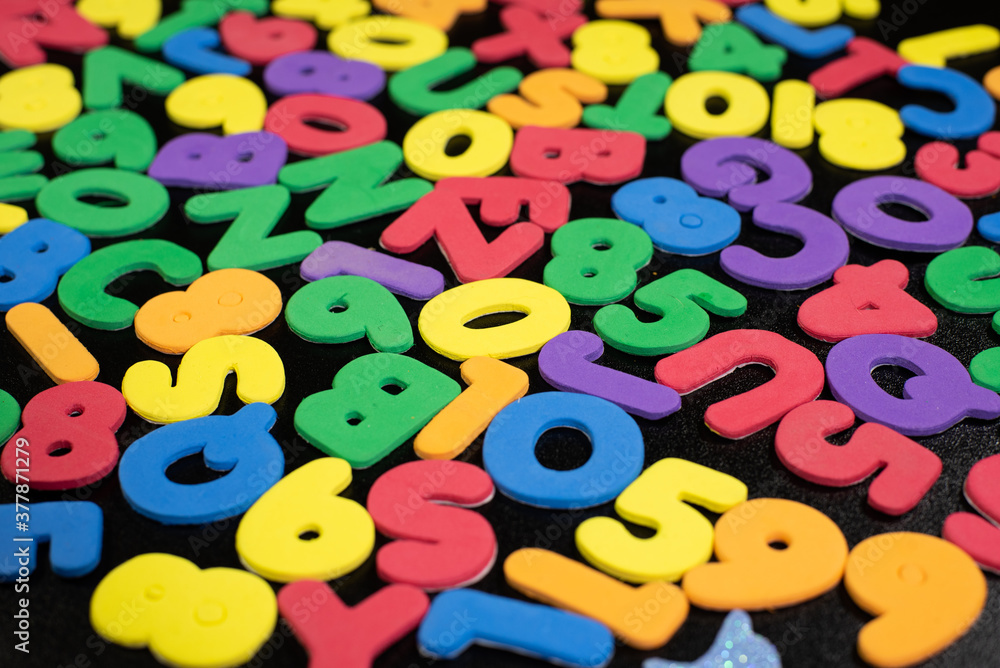 Multi Color Foam Alphabets in a random position children kids colorful background fun school. Multi Color Foam Alphabets in a random position children kids colorful background fun school.