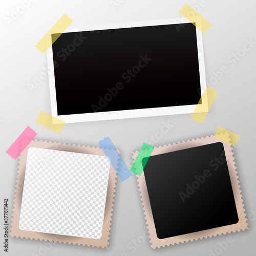 Old blank photo frame with tape