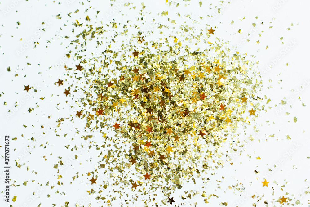 Splash of golden sparkles on white background. Celebratory background. Splash of golden sparkles on white background. Celebratory background.
