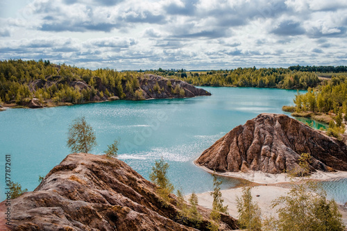 Konduki (Conduky) village, Tula region, Romancevskie mountains, Abandoned Ushakov quarries. Turquoise water lakes and the mud erosion of the soil looks like mountains. Beautiful natural landscape. photo