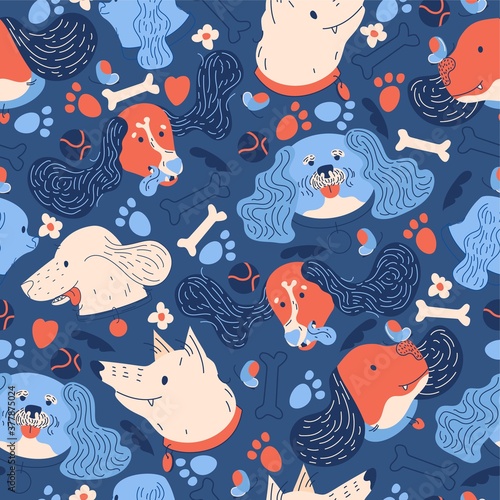 Seamless pattern with dogs heads. Vibrant colors on blue background. Lovely playful pets characters