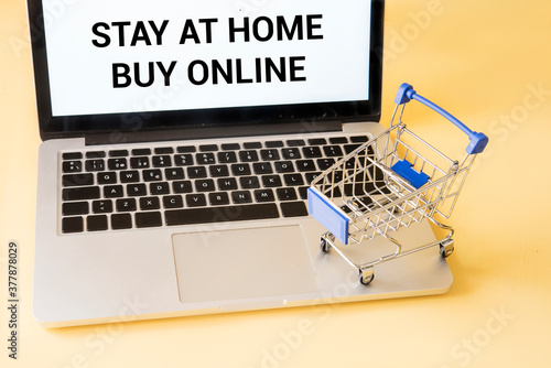 Shopping car with computer concept buy online in quarantine