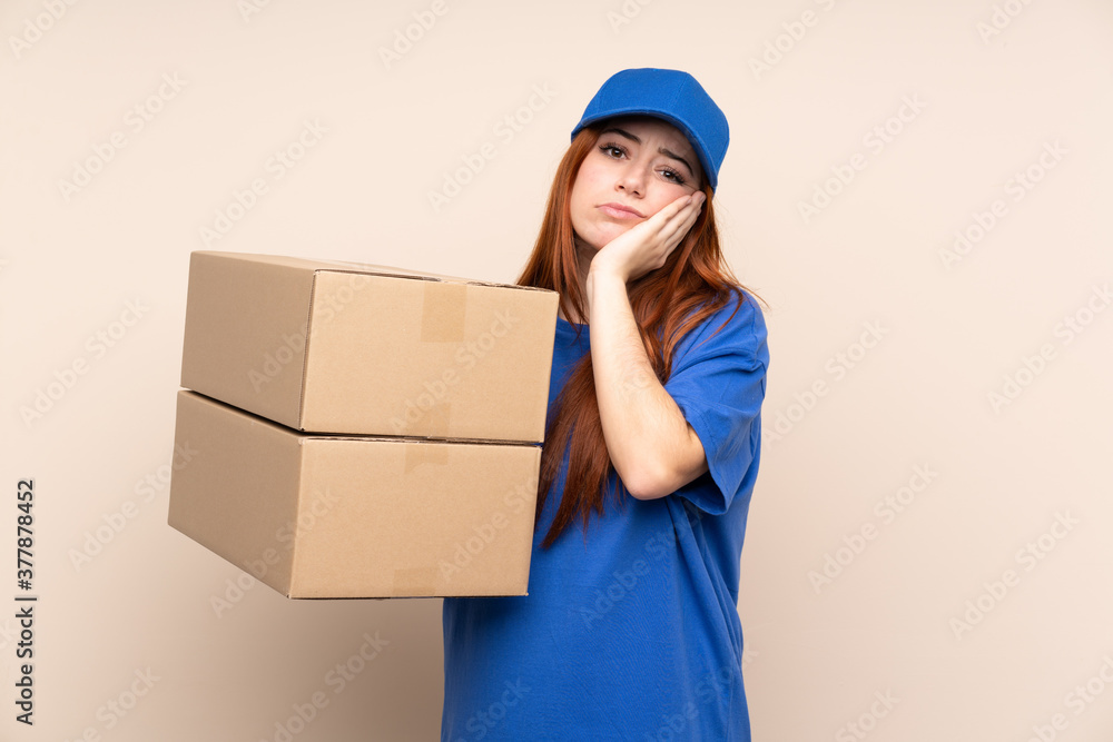 Young teenager delivery girl over isolated background unhappy and frustrated Young teenager delivery girl over isolated background unhappy and frustrated