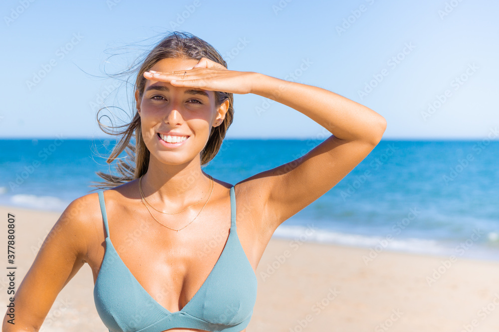 Woman enjoying sunbathing at beach Woman enjoying sunbathing at beach
