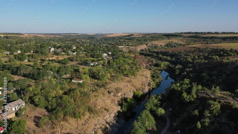 Europe, Buky, Ukraine - September 2020: Aerial view of the Buky canyon. View of the canyon and the Gorny Tikich River. Sheer cliffs of the canyon. Europe, Buky, Ukraine - September 2020: Aerial view of the Buky canyon. View of the canyon and the Gorny Tikich River. Sheer cliffs of the canyon.
