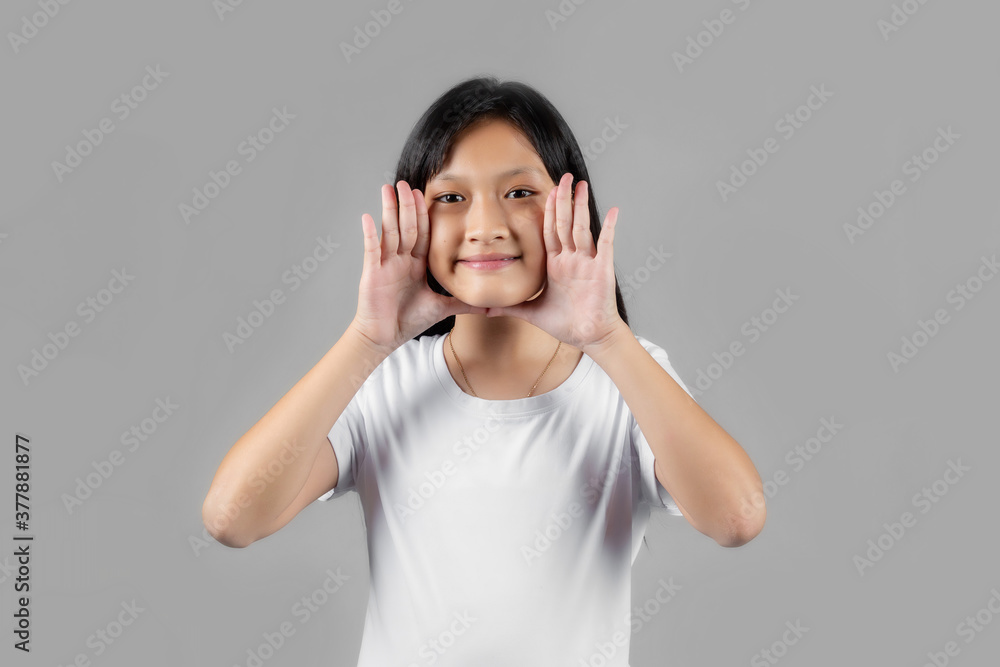 Asian girl studio portrait on gray background Asian girl studio portrait on gray background