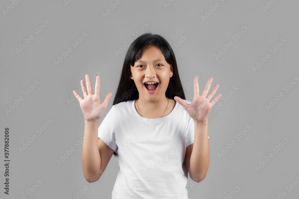 Asian girl studio portrait on gray background Asian girl studio portrait on gray background