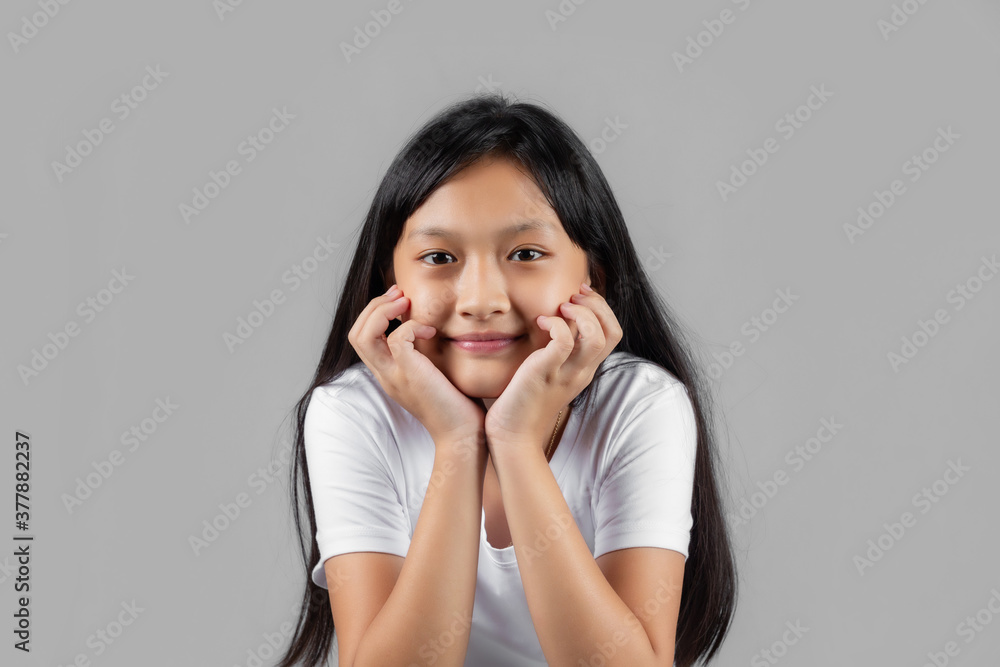Asian girl studio portrait on gray background Asian girl studio portrait on gray background